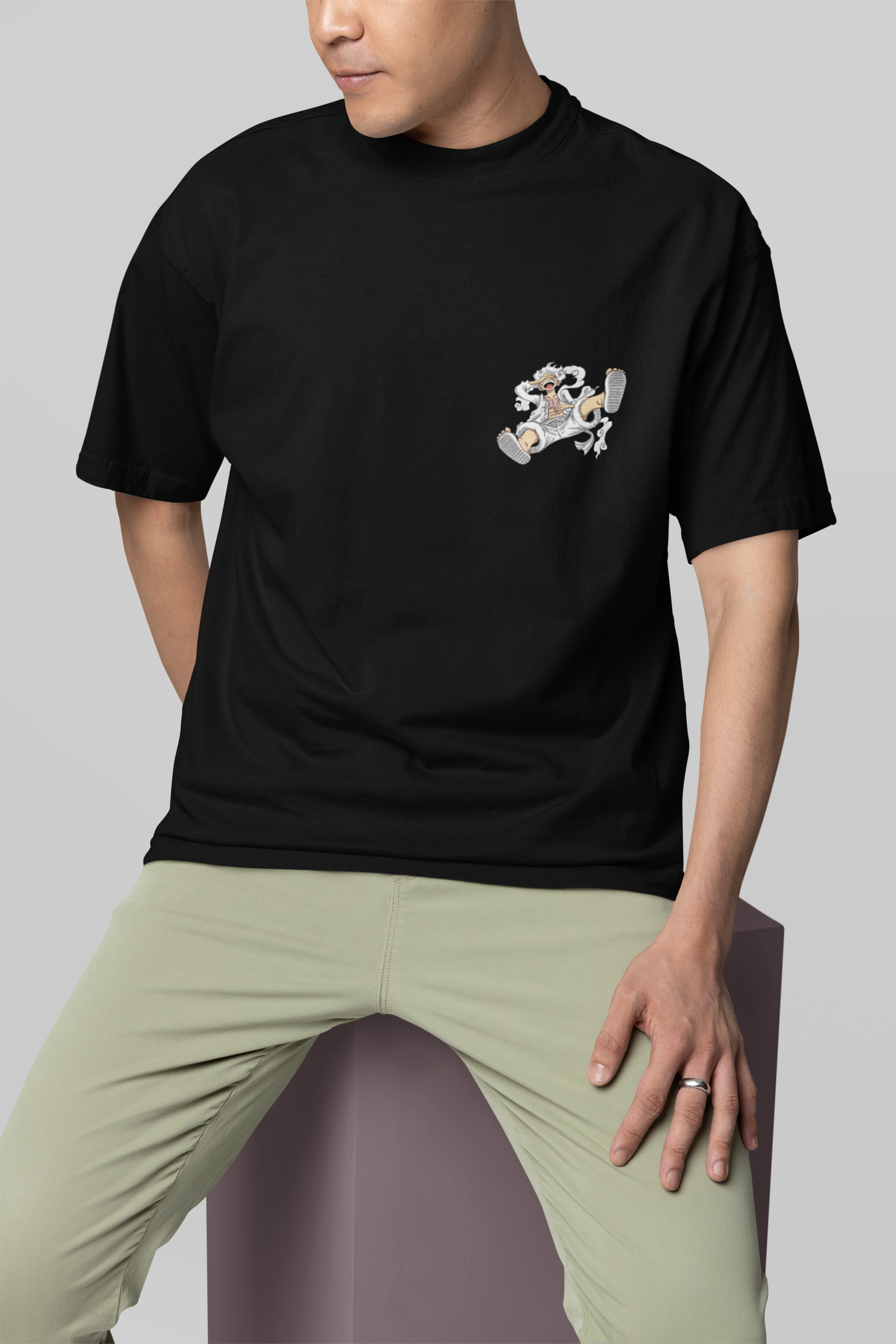 mockup-featuring-a-man-wearing-an-oversized-round-neck-tee-in-a-studio-m38923